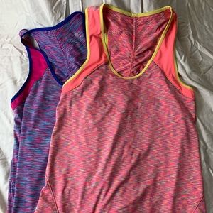2 Tangerine ladies Athletic tanks. Size Medium